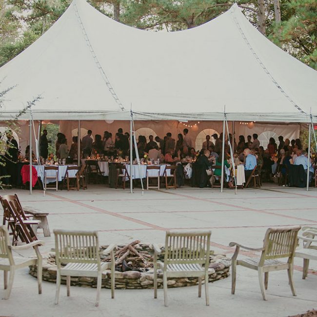 Wedding tent and court with guests having dinner